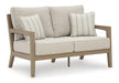 Hallow Creek Outdoor Loveseat with Cushion - Tony’s Furniture Store & Linen (GA) - Multi Location