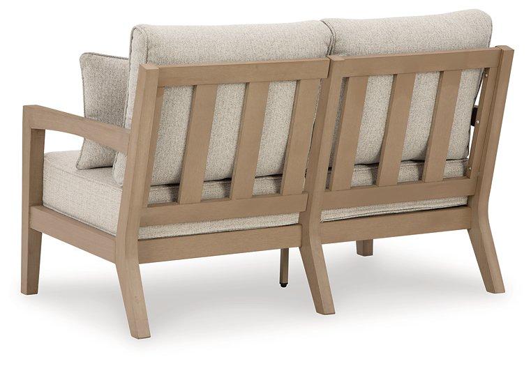 Hallow Creek Outdoor Loveseat with Cushion - Tony’s Furniture Store & Linen (GA) - Multi Location