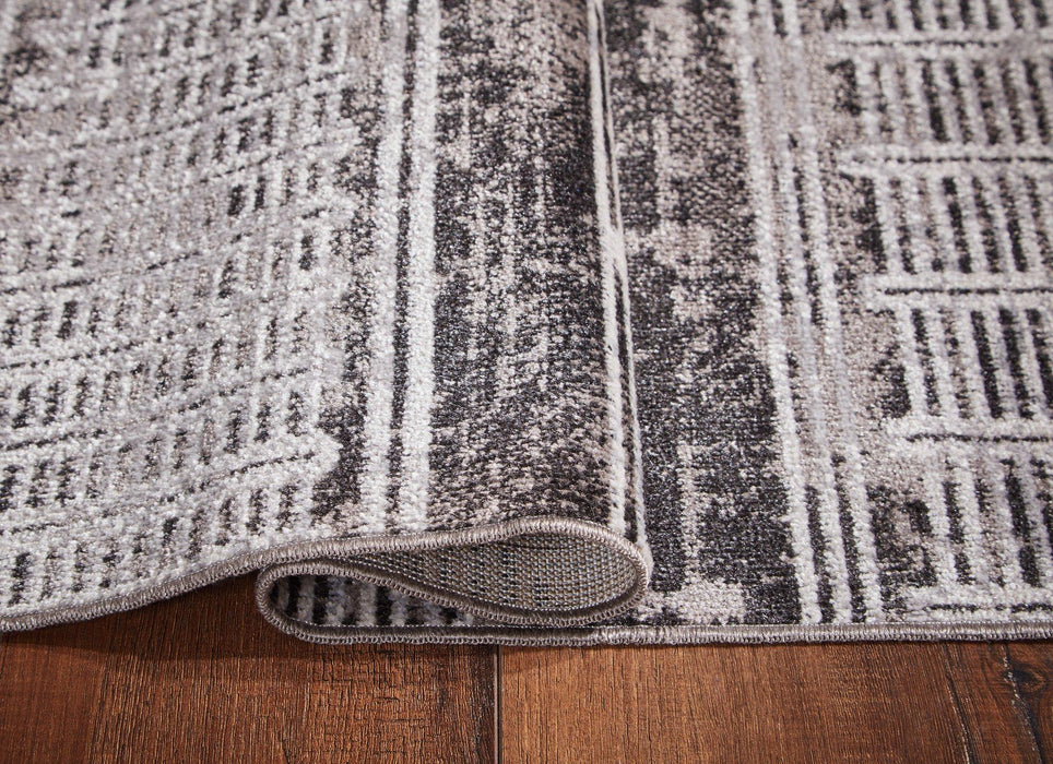 Henchester 5' x 7' Rug - Tony’s Furniture Store & Linen (GA) - Multi Location
