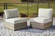 Calworth Outdoor Armless Chair with Cushion (Set of 2) - Tony’s Furniture Store & Linen (GA) - Multi Location